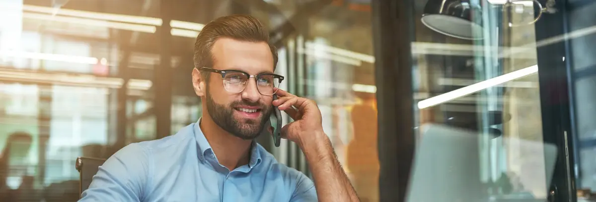 Business development and sales professional speaking with a client