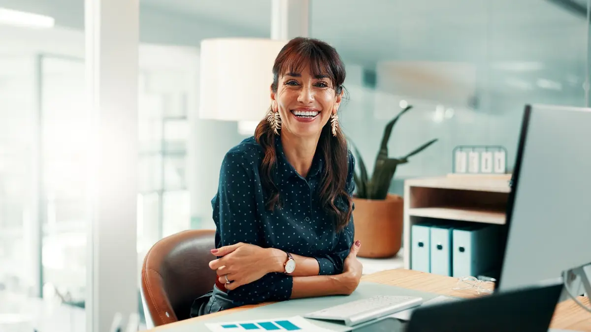 Executive and business support professional working at a desk