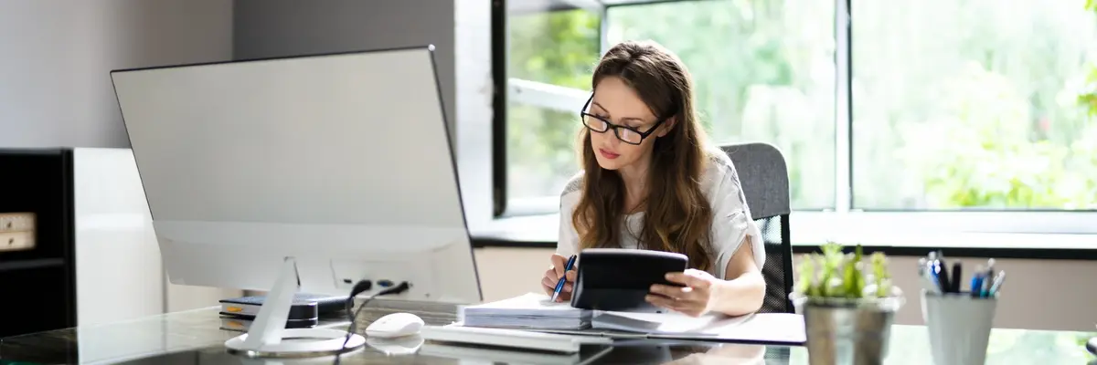 Operations and project management professional reviewing documents
